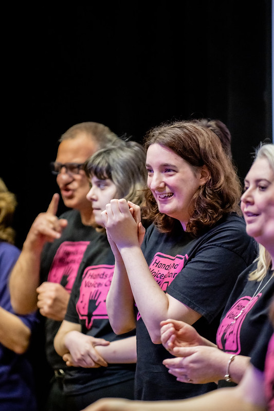 Hands & Voices member singing at the Big Birthday Bash concert