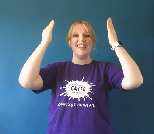 Photograph of Hannah delivering an online signing and signing session