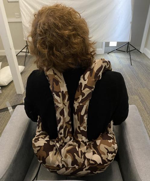 iMUSE Facilitator Tom models the Hugger, wearing it on his back