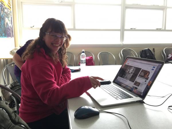 Photograph of an AbleWeb York participant using a computer for research