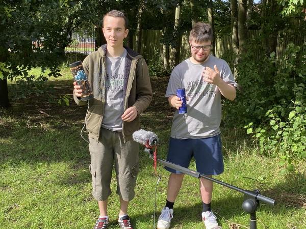 A photo of our IMPs members being filmed as part of our video