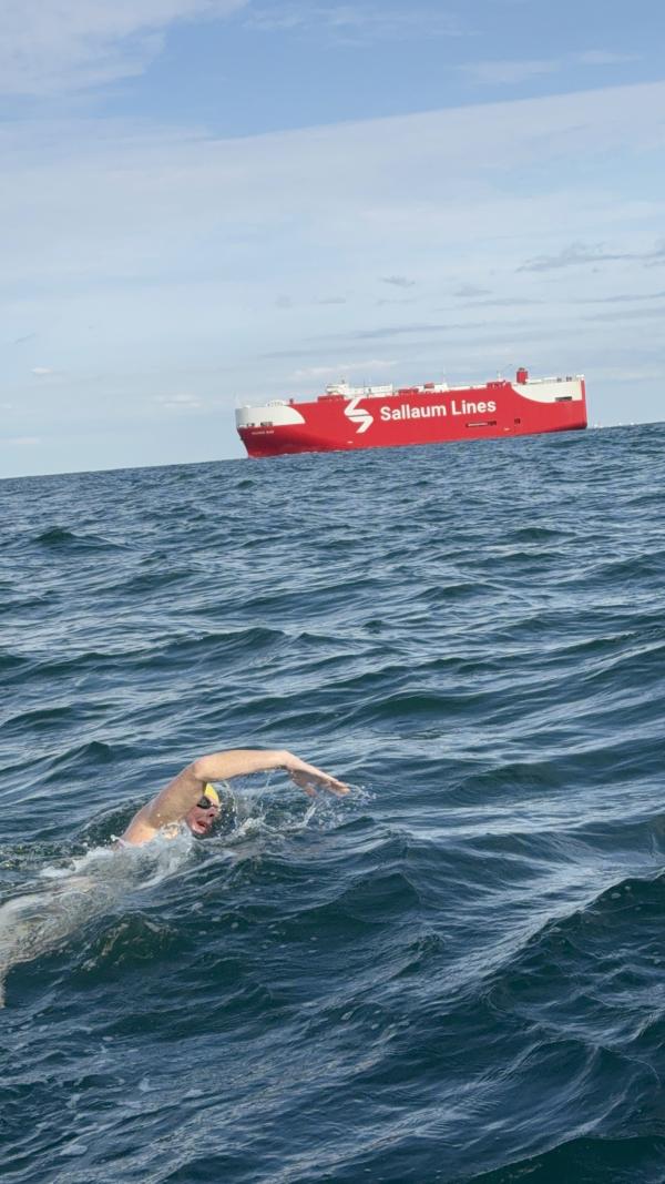 A photo of Nick swimming in the English Channel. It looks cold!